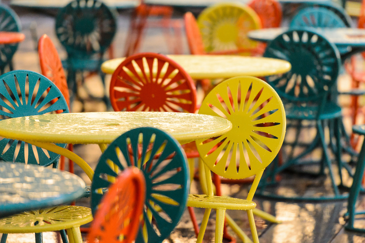 Rain soaked Sunburst Terrace chairs after a rainstorm at the Memorial Union.